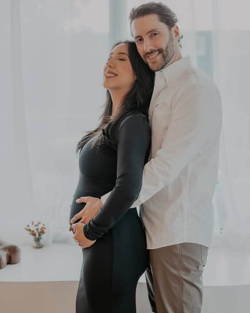 Expecting couple photographed in soft natural light